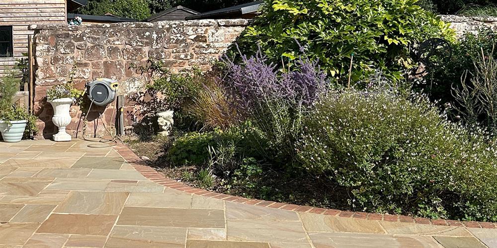 Curved patio and garden beds